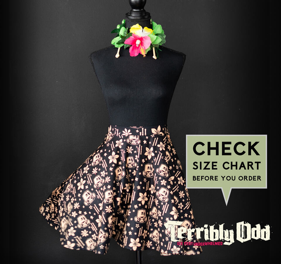 Terribly Odd Mr. Pernicious Tiki Skater Skirt featuring monkey idols, tropical flowers, bamboo accents, and a size chart reminder.