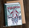 Book-shaped Krampus Christmas card featuring the Merry Lore of Krampus chasing children through a snowy village