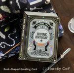 Magical witchy birthday card shaped like a spellbook featuring a crystal ball