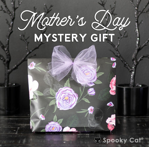 Mother’s Day mystery gift for your favorite goth mom, featuring $38 worth of spooky cute goodies wrapped in dark, festive gift paper.