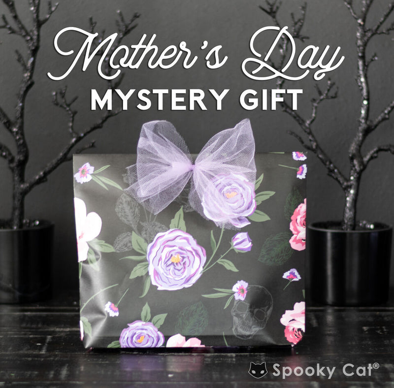 Mother’s Day mystery gift for your favorite goth mom, featuring $38 worth of spooky cute goodies wrapped in dark, festive gift paper.