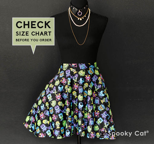Neon Classic Monsters skirt with Dracula, Frankenstein, Wolfman, Mummy, and other retro horror icons in bright colors on black.