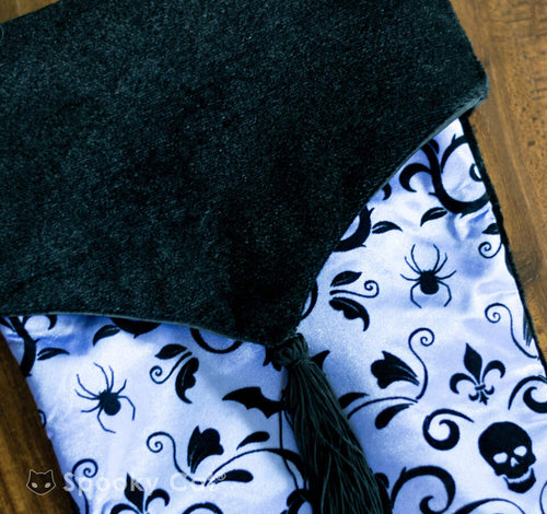 Gothic Creepmas stocking in purple satin with velvet cuff and silver details