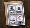 Gothic Christmas greeting card showing eerie snow globe designs with a haunted holiday theme.