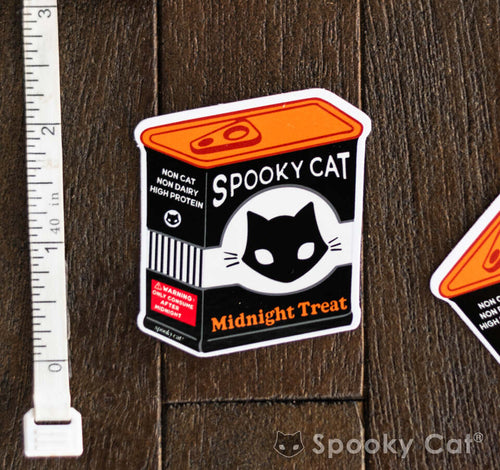Diecut vinyl sticker of a spooky snack can labeled “Spooky Cat Midnight Treat” with gothic design elements.