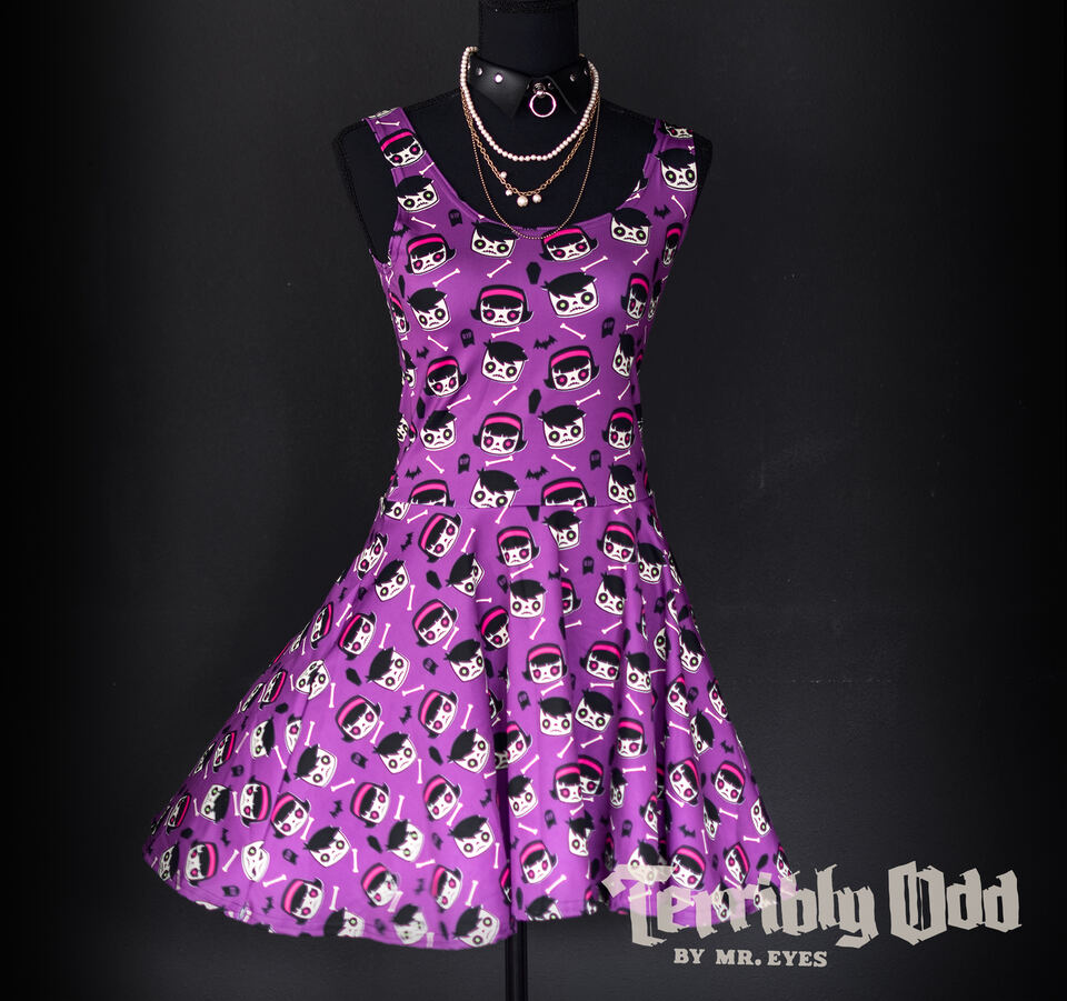 A dress form wearing a Terribly Odd Coffin Kid skater dress featuring a boy and girl, bats, bones, and tombstones on a purple background. The Terribly Odd brand logo appears in the bottom right corner with the text NO AI, made by artists.