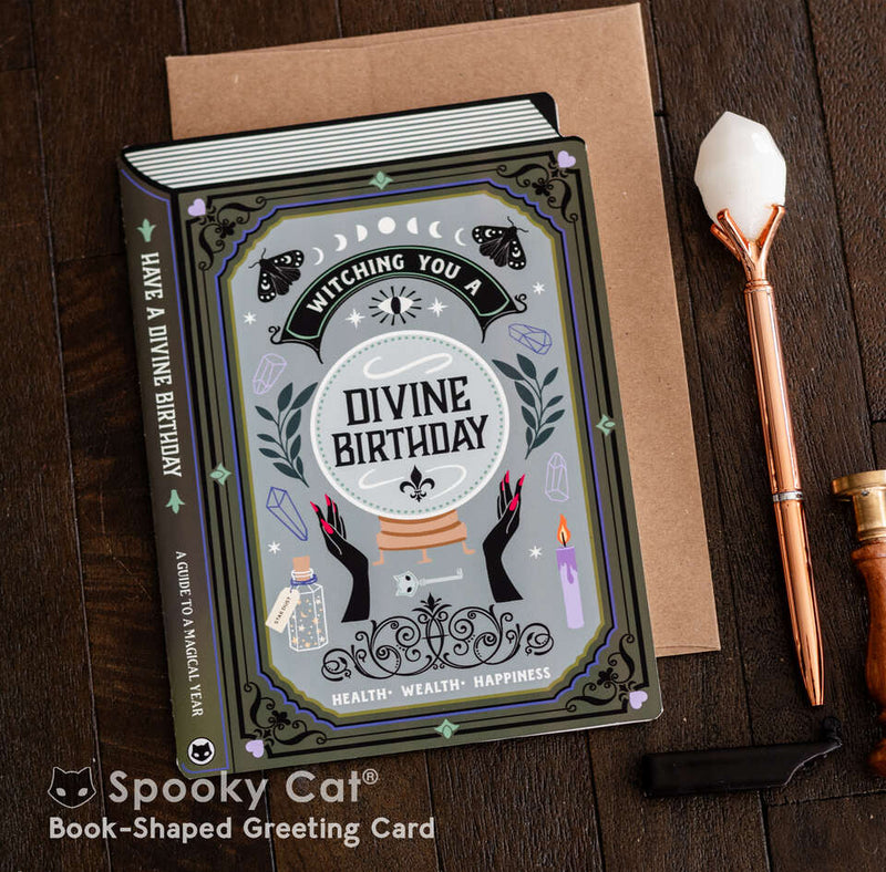 Magical witchy birthday card shaped like a spellbook featuring a crystal ball